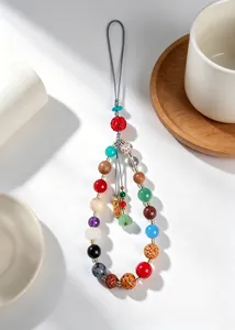 Detailed view of 18-bead multi-material phone strap with bodhi seeds and crystals.