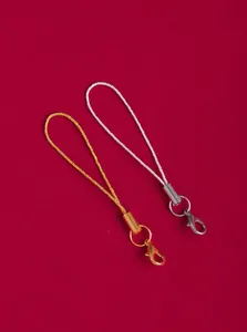 Close-up of durable gold and silver lobster clasp phone charm lanyards for DIY accessory making.