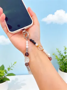 Exquisite detail of a nine-tailed fox crystal beaded phone strap charm with obsidian