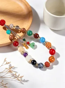 Detailed view of traditional 18-bead charm with multi-material Bodhi seeds and crystals.