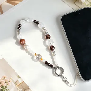 Elegant beaded phone strap with white crystal, phantom quartz and carved fox bead.