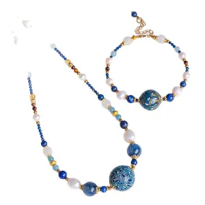 Set di gioielli fatti a mano con cristalli di acquamarina e perle d'acqua dolce elegante