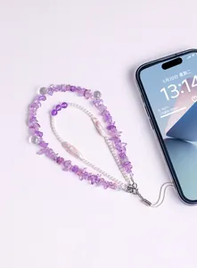 Detailed view of a handmade amethyst crystal chips and pearl beaded phone charm strap