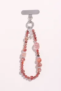 Close-up of strawberry quartz beaded phone charm with silver metal clasp and insert