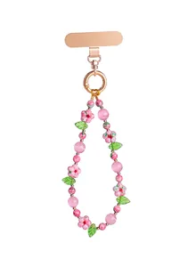 Detailed view of handmade pink floral beaded phone strap with gold-tone lobster clasp.