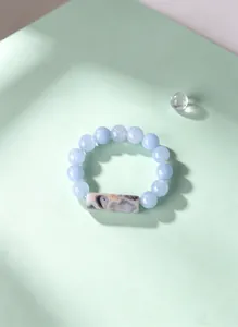 Detailed view showing the unique texture of the agate bead on this natural stone elastic ring.