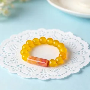 Vintage handmade elastic beaded ring with honey yellow crystal beads and agate cylinder