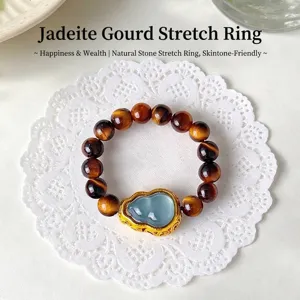 Elegant natural tiger eye beaded ring with a jadeite gourd centerpiece in gold setting