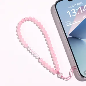 Handgefertigter Handy-Anhänger aus rosa Kristallperlen mit herzförmigen Akzenten