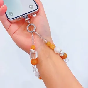 Elegant hand-beaded phone strap with natural yellow crystals and white jade beads