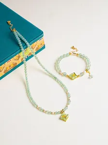 Natural aventurine and freshwater pearl jewelry set with elegant gold orchid pendants