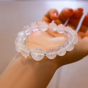 Elegante pulsera de cuarzo rosa fantasma copo de nieve con espaciadores de plata