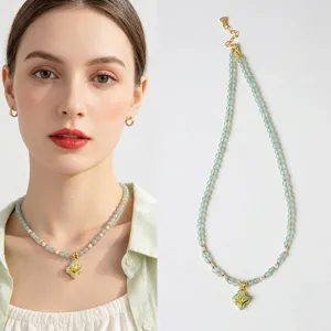 Elegant natural green Aventurine and pearl necklace featuring orchid enamel pendant