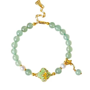 Elegant oriental style aventurine jade and freshwater pearl bracelet with gold floral charm