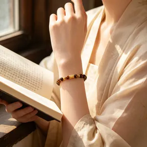 Elegantes Damenarmband aus natürlichen Tigeraugen-Steinen mit goldenem Hohl-Anhänger