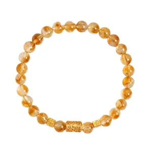 Elegantes Armband aus natürlichem gelbem Citrin-Kristall mit kunstvollen goldenen Anhängern