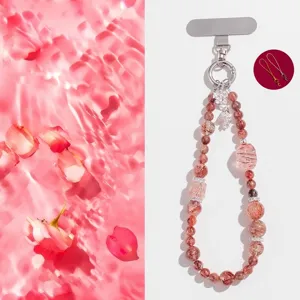 Natural strawberry crystal beaded phone strap lanyard with elegant rose gold hardware.