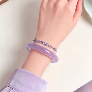 Elegant purple cat's eye stone bangle and crystal flower bracelet jewelry set for women.