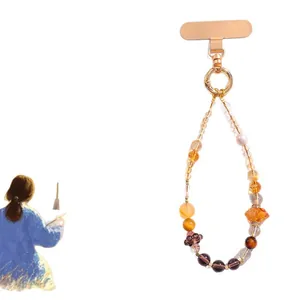 Elegant natural pearl and yellow crystal beaded phone strap charm with gold metal tab