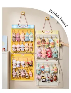 Wall-mounted plush doll storage bag showing multi-pocket display layout