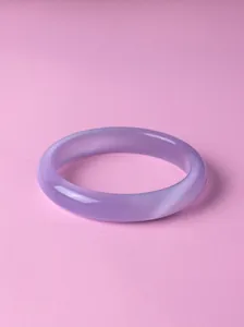 Close-up detail showing the translucent texture of a lavender purple gemstone bangle