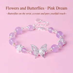Elegant lavender amethyst beaded bracelet with silver butterfly charm on pink background
