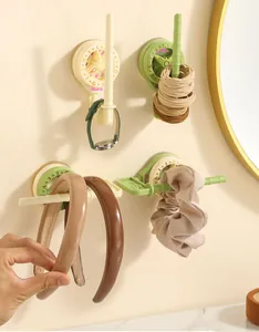 Rotating suction cup wall hooks for organizing hairbands, scrunchies and hair accessories