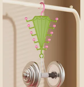 Multi-hook V-shaped storage hanger demonstrated with heavy dumbbell for durability