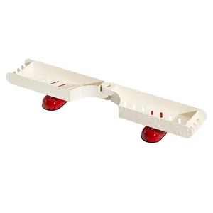 Cream-colored foldable bathroom shelf with drainage slots and dual red suction cups