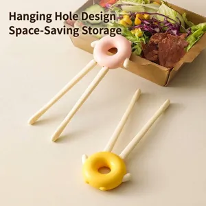 Creative donut-shaped snack clips for clean-hand eating, pink and yellow tongs for food