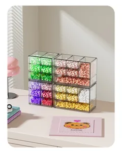 Detailed view of transparent stackable drawer storage containers for colorful craft beads
