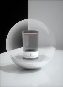 Detailed macro shot of the minimalist automatic electric makeup brush cleaner device