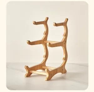 Detailed view of a three-tier bamboo display stand for snack trays and fruit plates
