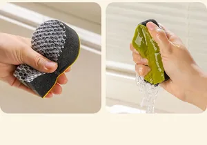 Detail showing the mesh texture and high water absorption of the cleaning sponge.