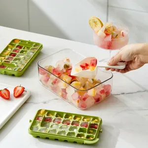 Green silicone flip-press ice cube tray set with storage box and white plastic scoop