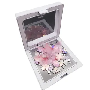 Set de decoración facial profesional con perlas y mariposas en estuche blanco con espejo.