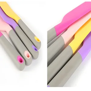 Detail view of colorful silicone baking spatula handles showing ergonomic design
