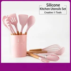 Pink silicone kitchen utensil set with ergonomic wooden handles and storage bucket