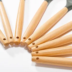 Dark grey silicone kitchen utensil set with natural wooden handles detail view