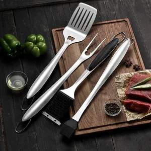 16-inch stainless steel BBQ tool set including spatula, fork and brushes on wooden board.