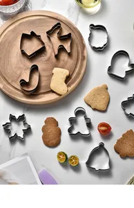 Detailed view of stainless steel Christmas cookie cutters with gingerbread and snowflake shapes