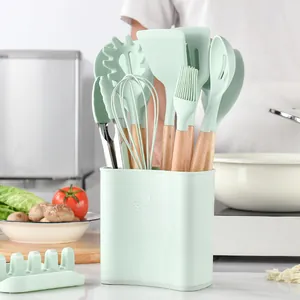 13-piece mint green silicone kitchen utensil set with wooden handles and storage bucket