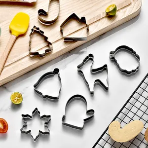 12-piece stainless steel Christmas cookie cutter set with various festive holiday shapes