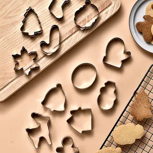 12-piece Christmas cookie cutter set featuring trees, gingerbread men, and snowflakes.