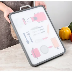 Detail of cartoon kitchen utensil patterns on a white antibacterial plastic cutting board