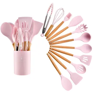 11-piece pink silicone kitchenware set with natural wooden handles and storage bucket