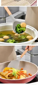 Detail view of grey silicone spatula and slotted spoon with wooden handles in use