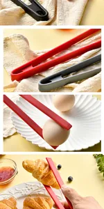 Close-up of silicone food tongs picking up a croissant and egg in a warm kitchen setting.