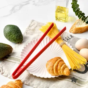 Red silicone non-slip food tongs for serving bread, pasta, and BBQ, heat-resistant tool