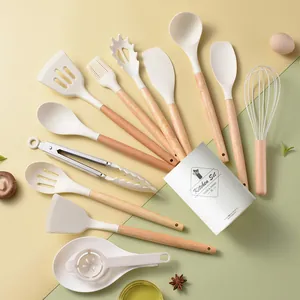 14-piece cream silicone kitchen utensil set with natural wood handles and storage bucket